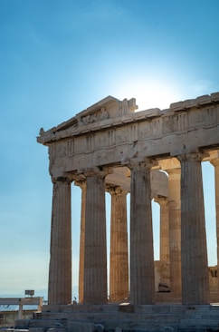 a very tall building with some columns on top of it