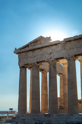 a very tall building with some columns on top of it