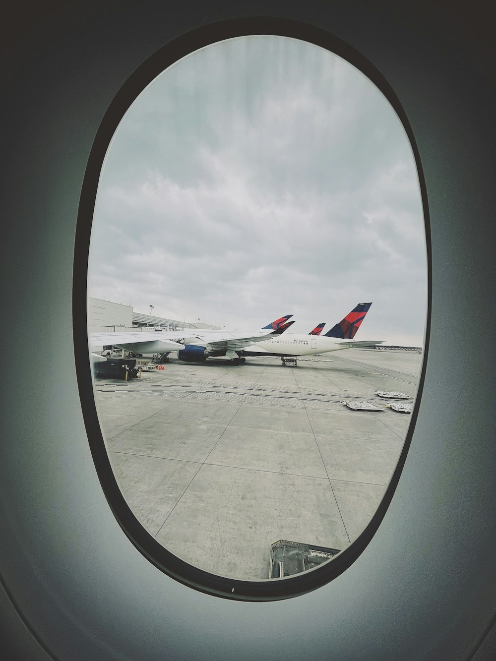 a view of a runway from a window of an airplane