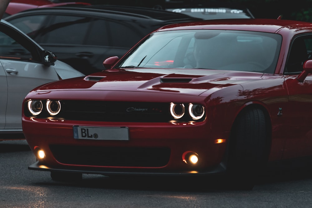 a red sports car parked in a parking lot