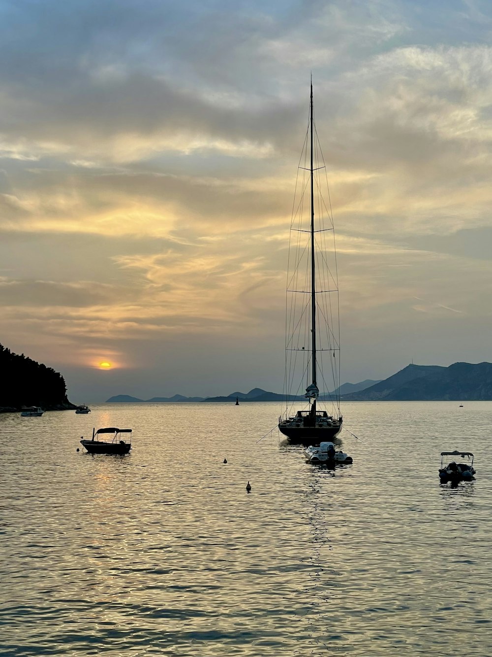 a group of boats floating on top of a body of water