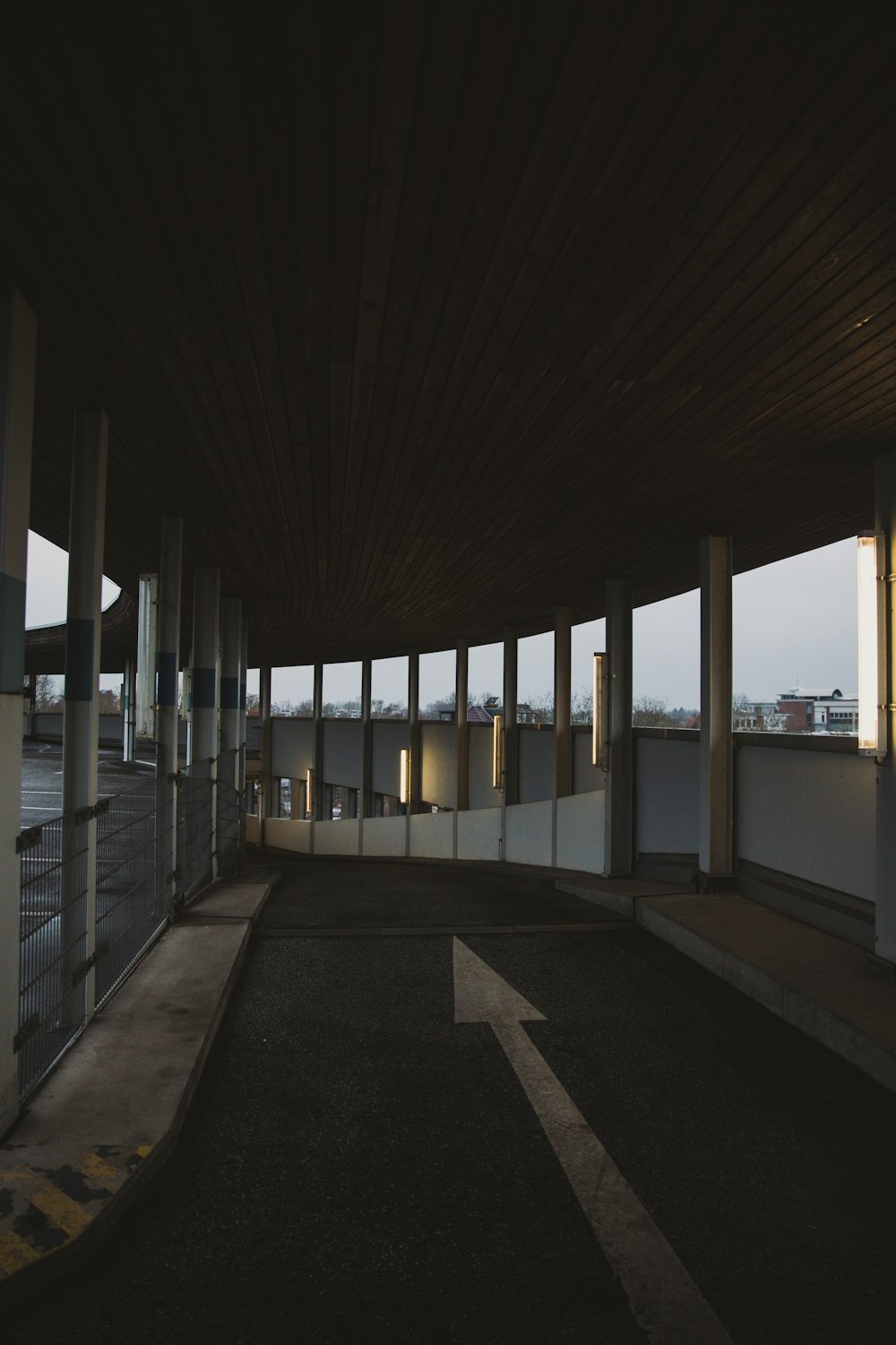 an empty parking garage with lots of windows