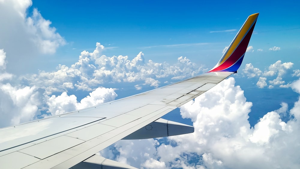 a view of the wing of an airplane in the sky