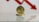 A gold-colored coin with Ethereum's symbol is prominently displayed against a backdrop of a red downward arrow, symbolizing a decrease or decline.