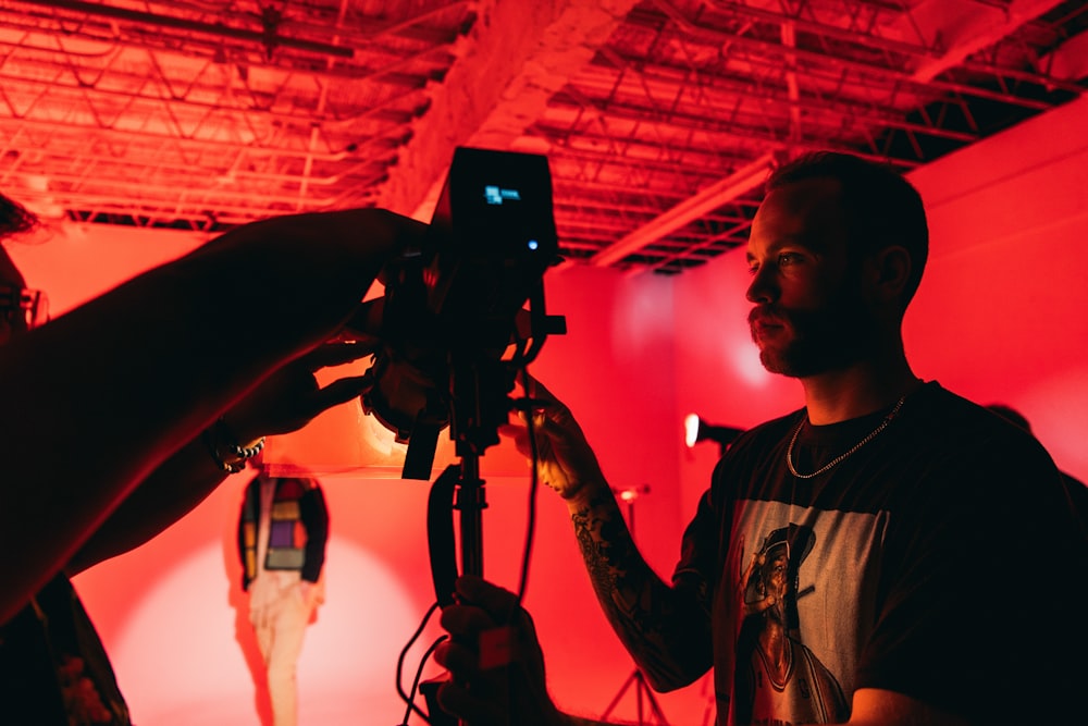 a man taking a picture of a woman with a camera