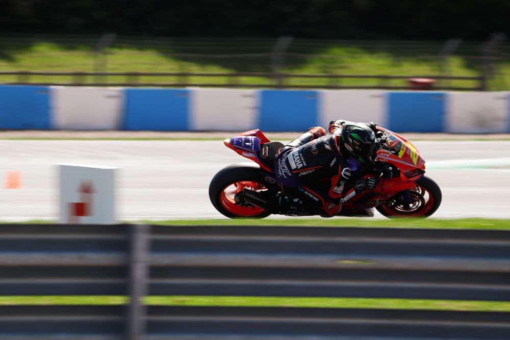 a person riding a motorcycle on a race track