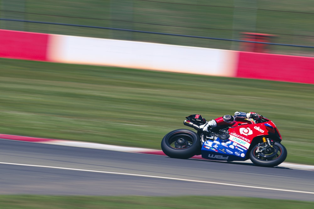 a person riding a motorcycle on a race track