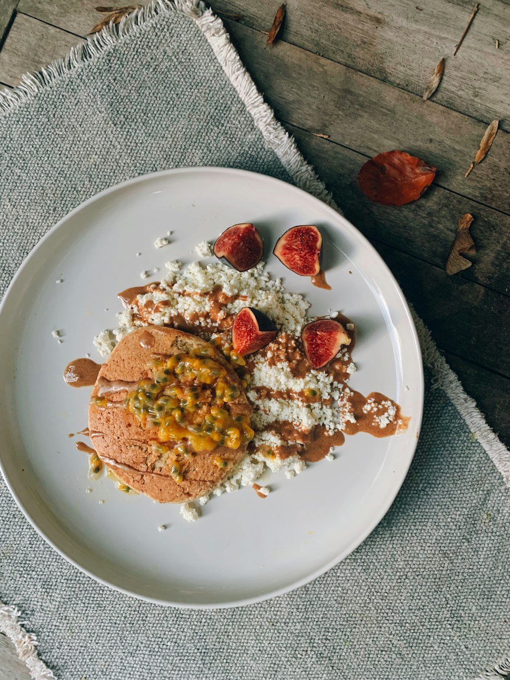 a white plate topped with food on top of a table