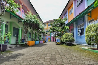 a cobblestone street lined with colorful houses