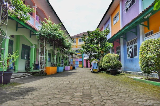 a cobblestone street lined with colorful houses