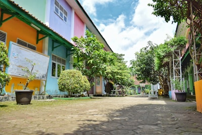 a cobblestone street lined with colorful buildings