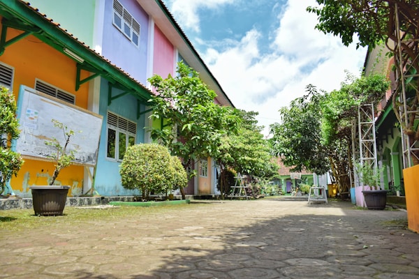 a cobblestone street lined with colorful buildings