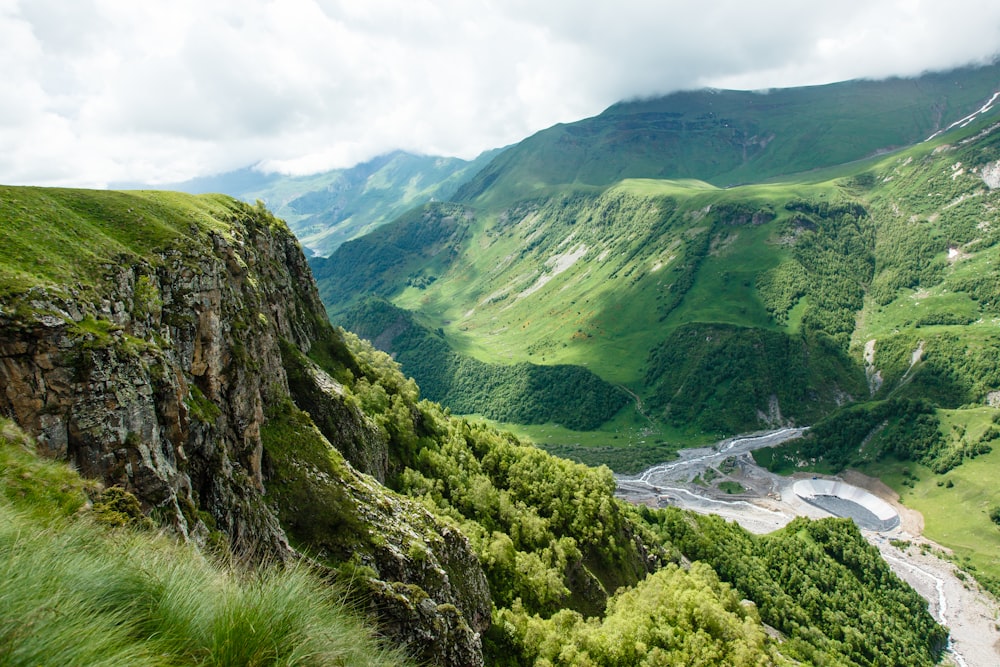 a view of a valley with a river running through it