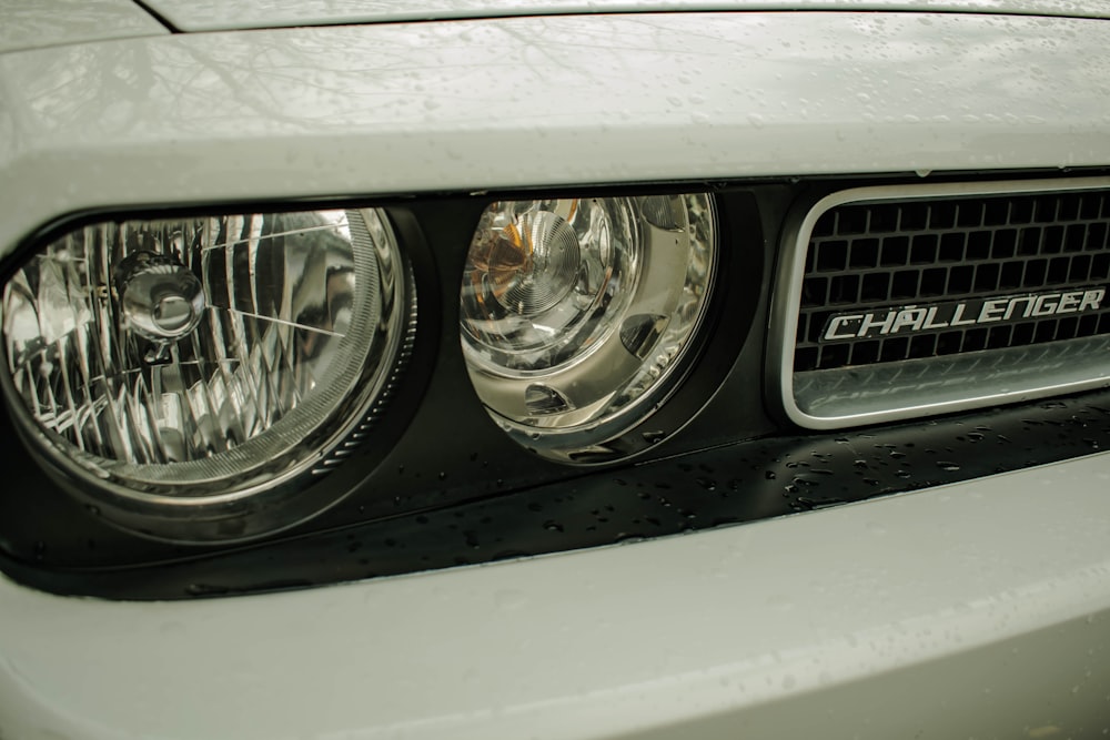 a close up of the front of a white car