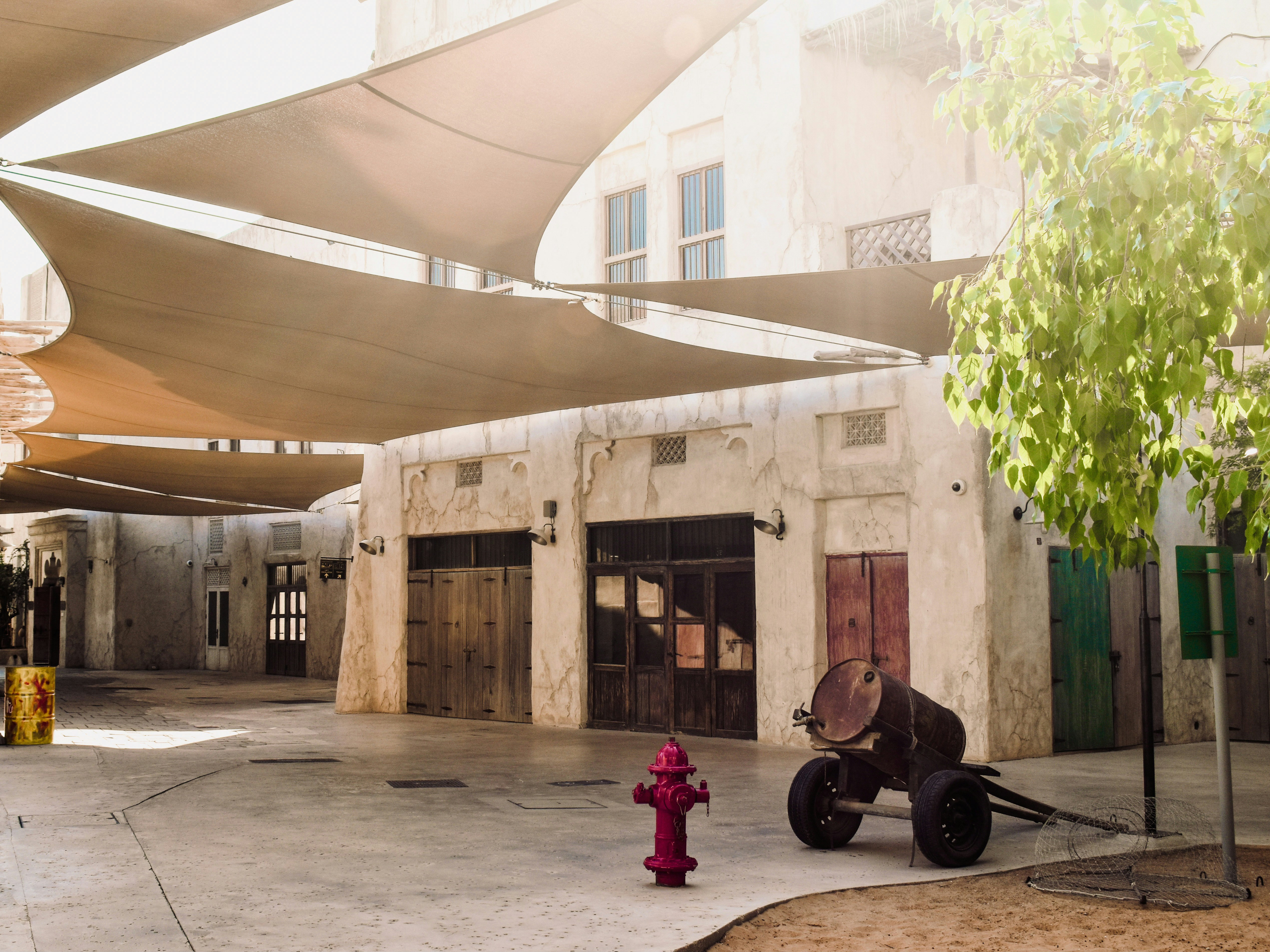 a red fire hydrant sitting in front of a building