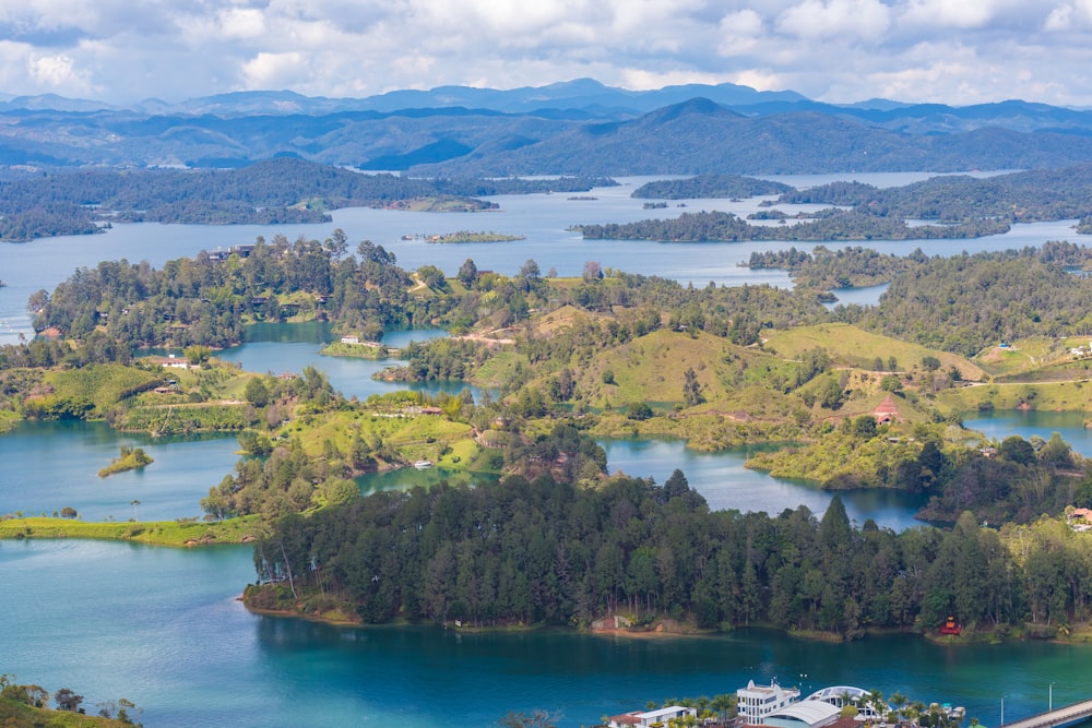 an aerial view of a lake surrounded by mountains