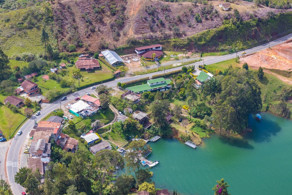 an aerial view of a lake and a road