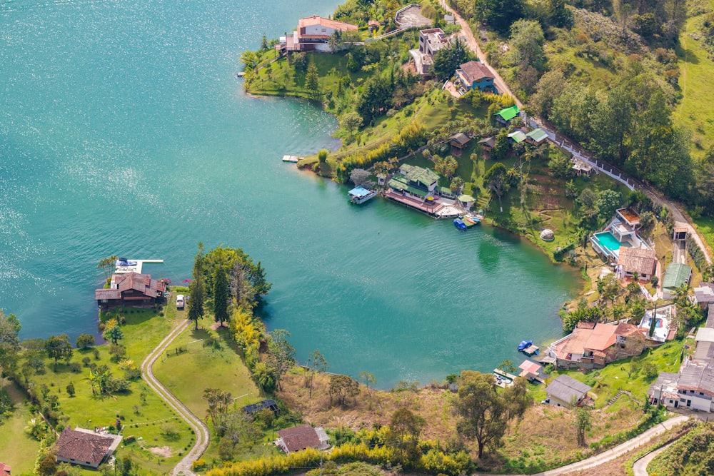 an aerial view of a lake surrounded by trees