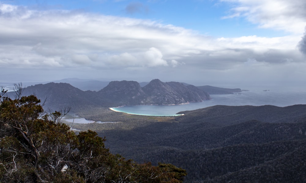 a view of a mountain range with a body of water in the distance