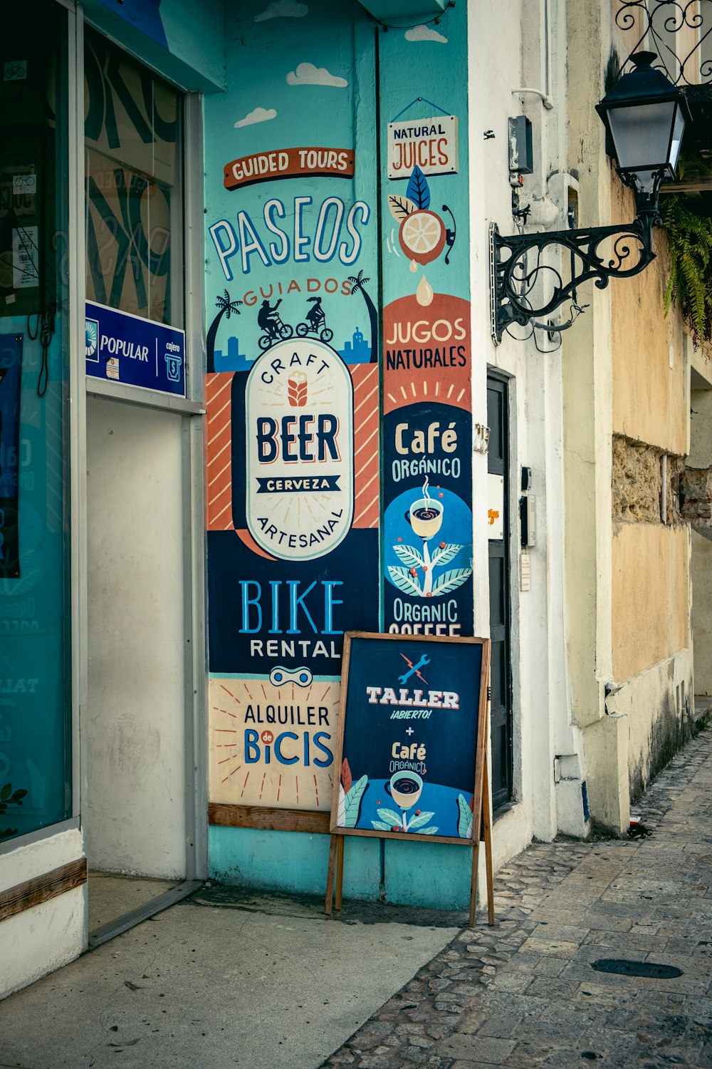 a store front with signs on the side of it