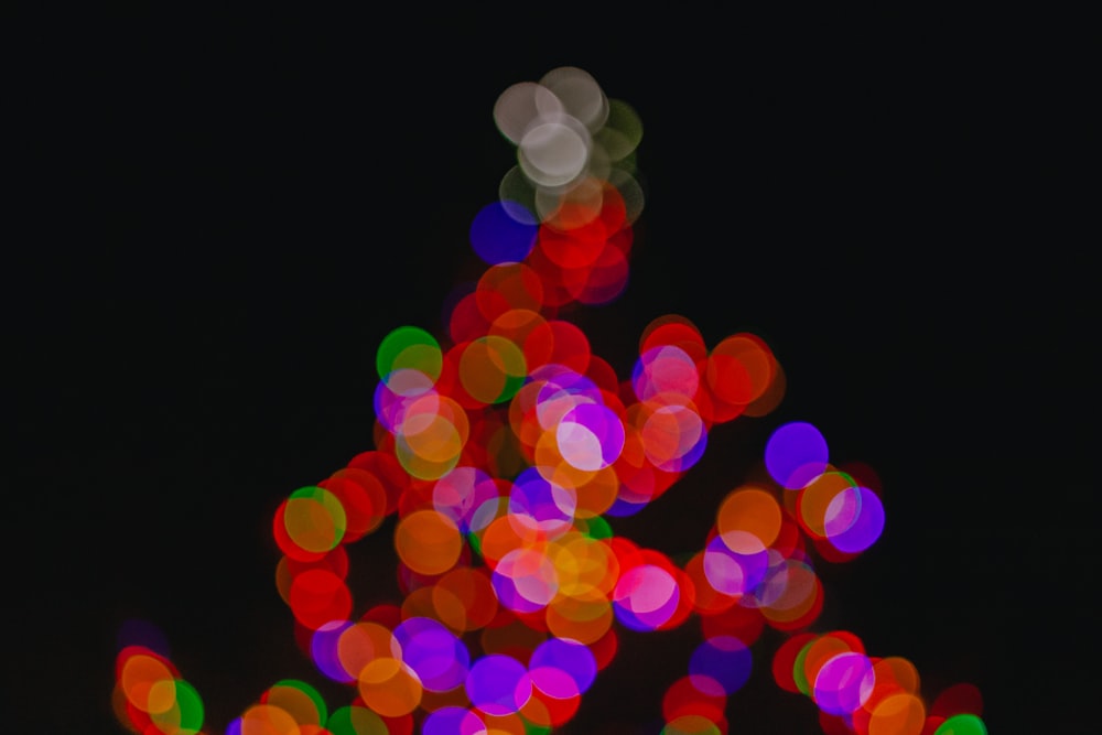 a blurry photo of a christmas tree with lights