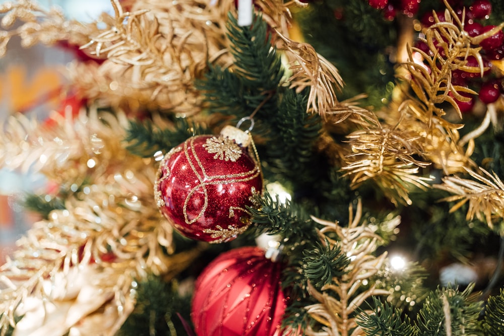 a close up of a christmas tree with ornaments