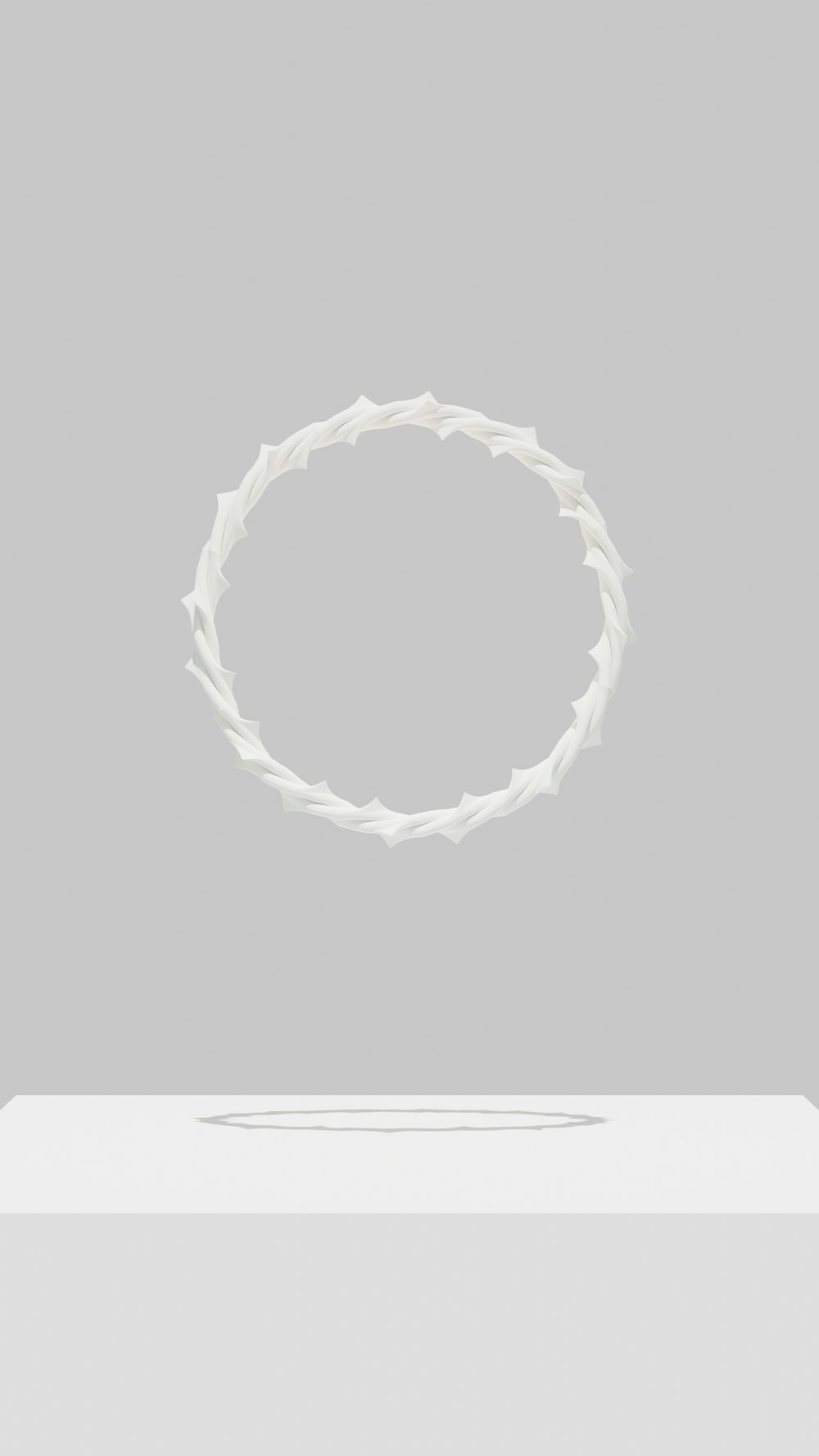 una caja blanca con un objeto blanco en el medio
