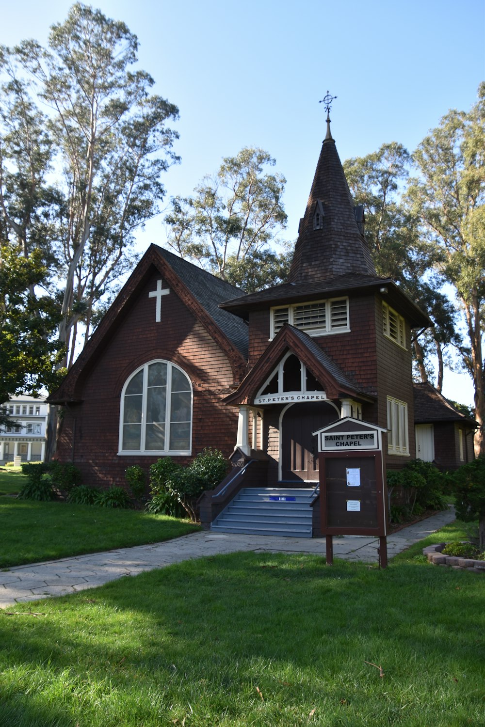 a church with a steeple and a steeple with a cross on it