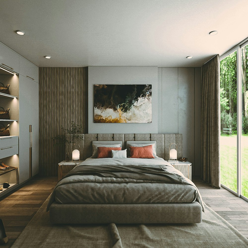 a bedroom with a large bed and a painting on the wall