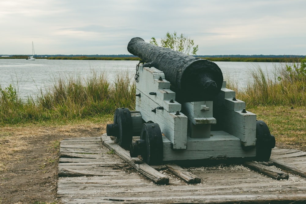 a cannon sitting on top of a wooden crate