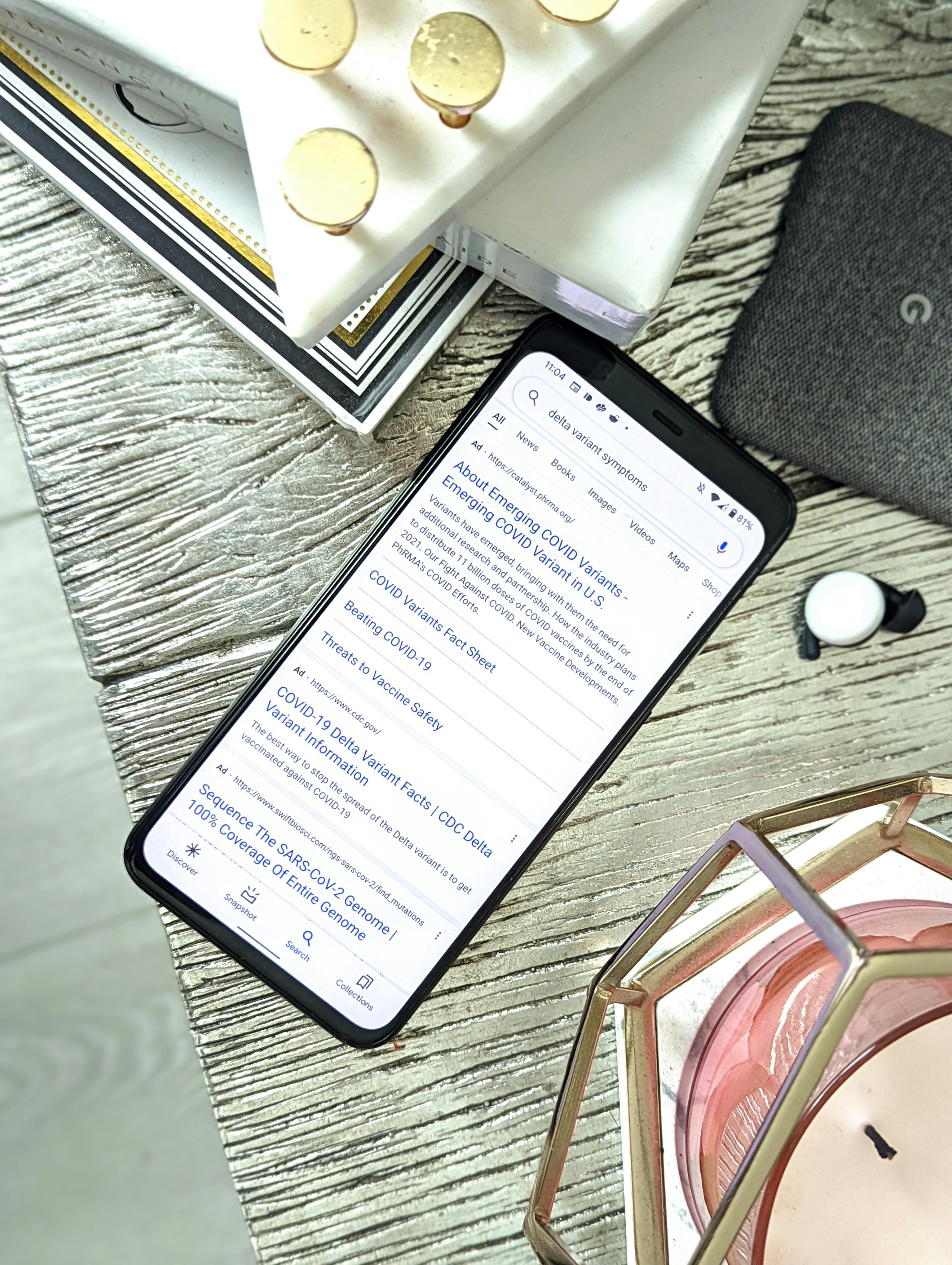 a cell phone sitting on top of a wooden table