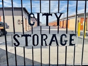 a sign that reads city storage behind a gate