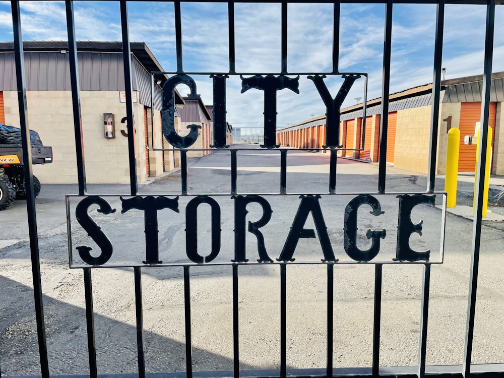 a sign that reads city storage behind a gate