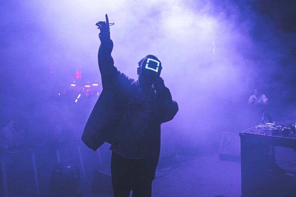 a man wearing a mask and holding up a gun