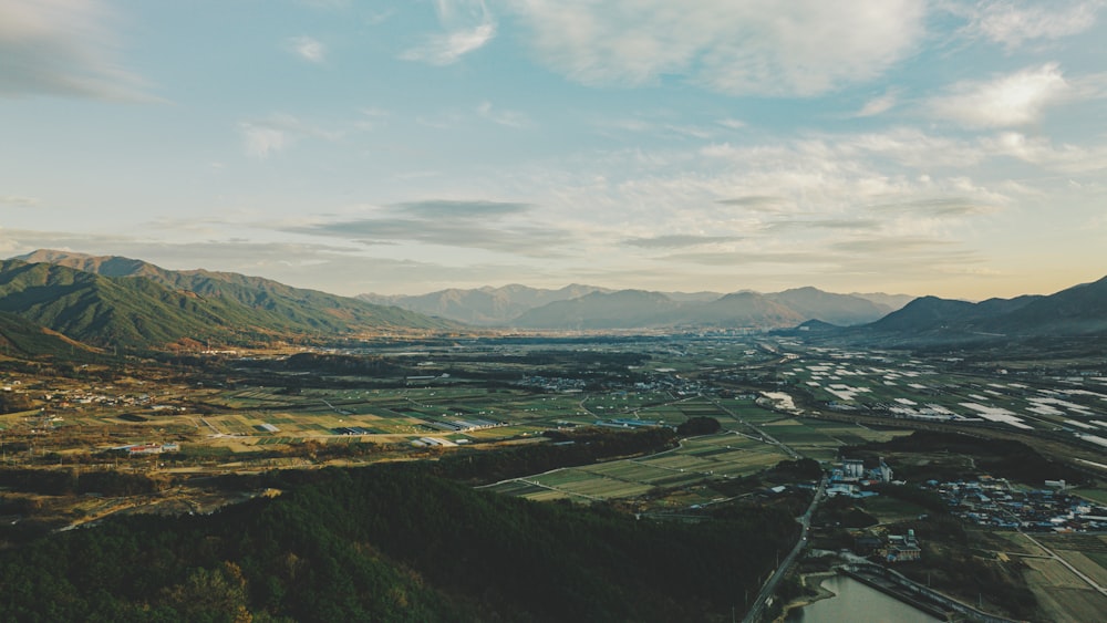 an aerial view of a valley and mountains