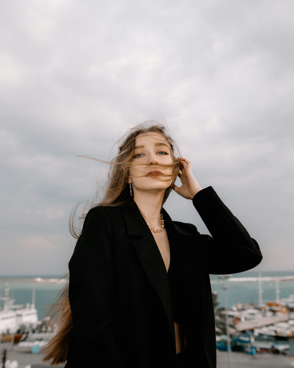 a woman with her hair blowing in the wind