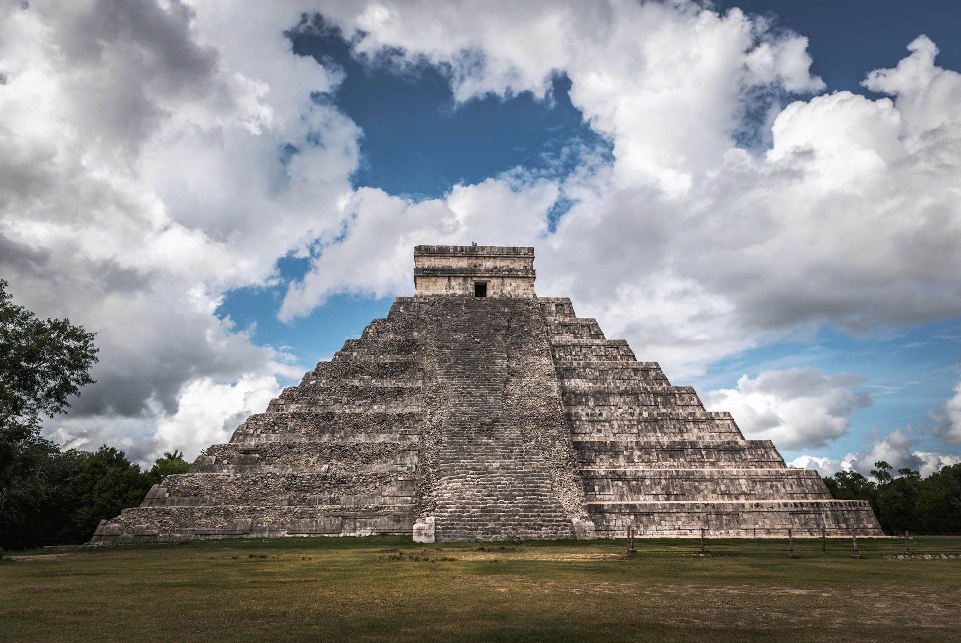 a large pyramid in the middle of a field