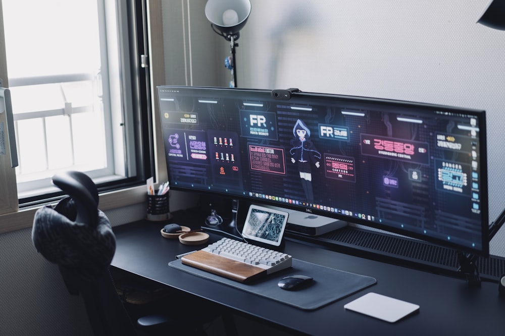 a computer monitor sitting on top of a desk