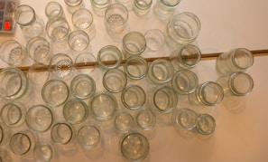 A collection of jars arranged beautifully on a wooden table.