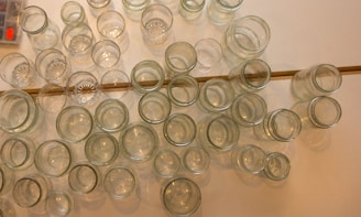 A collection of jars arranged beautifully on a wooden table.