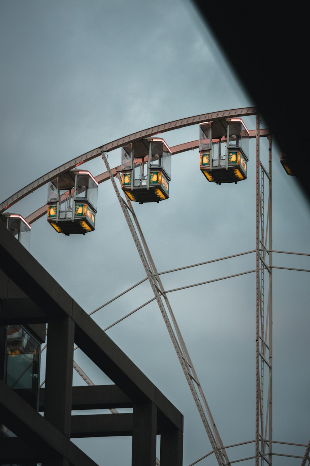 a roller coaster with lights on the top of it