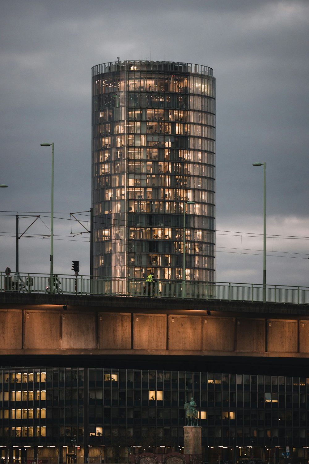 a very tall building sitting on top of a bridge