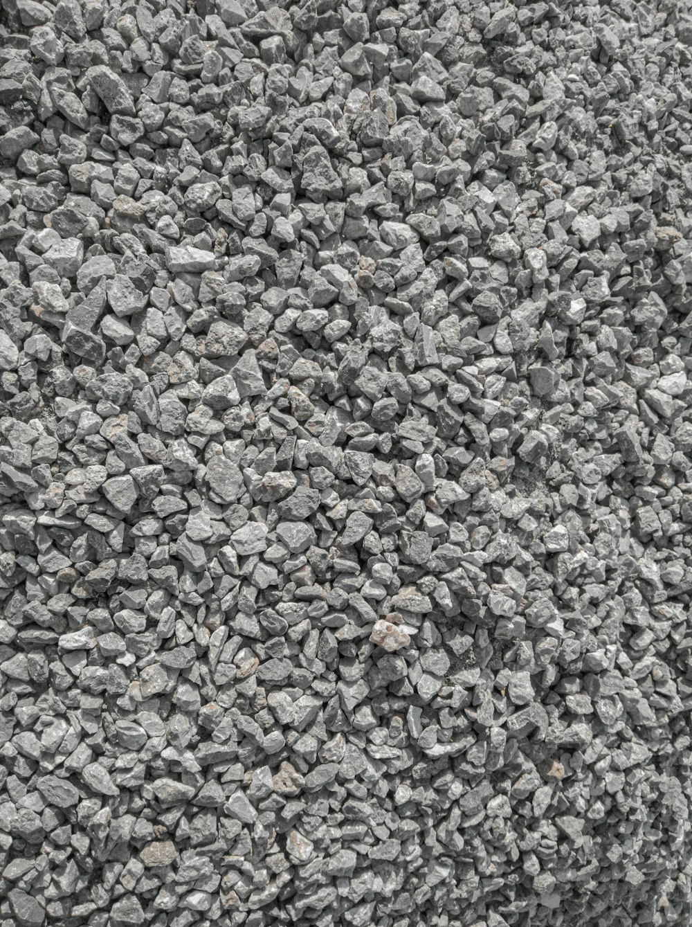 a black and white photo of rocks and gravel