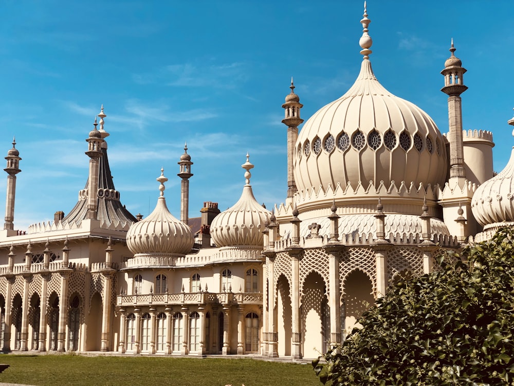 a large white building with lots of domes on top of it