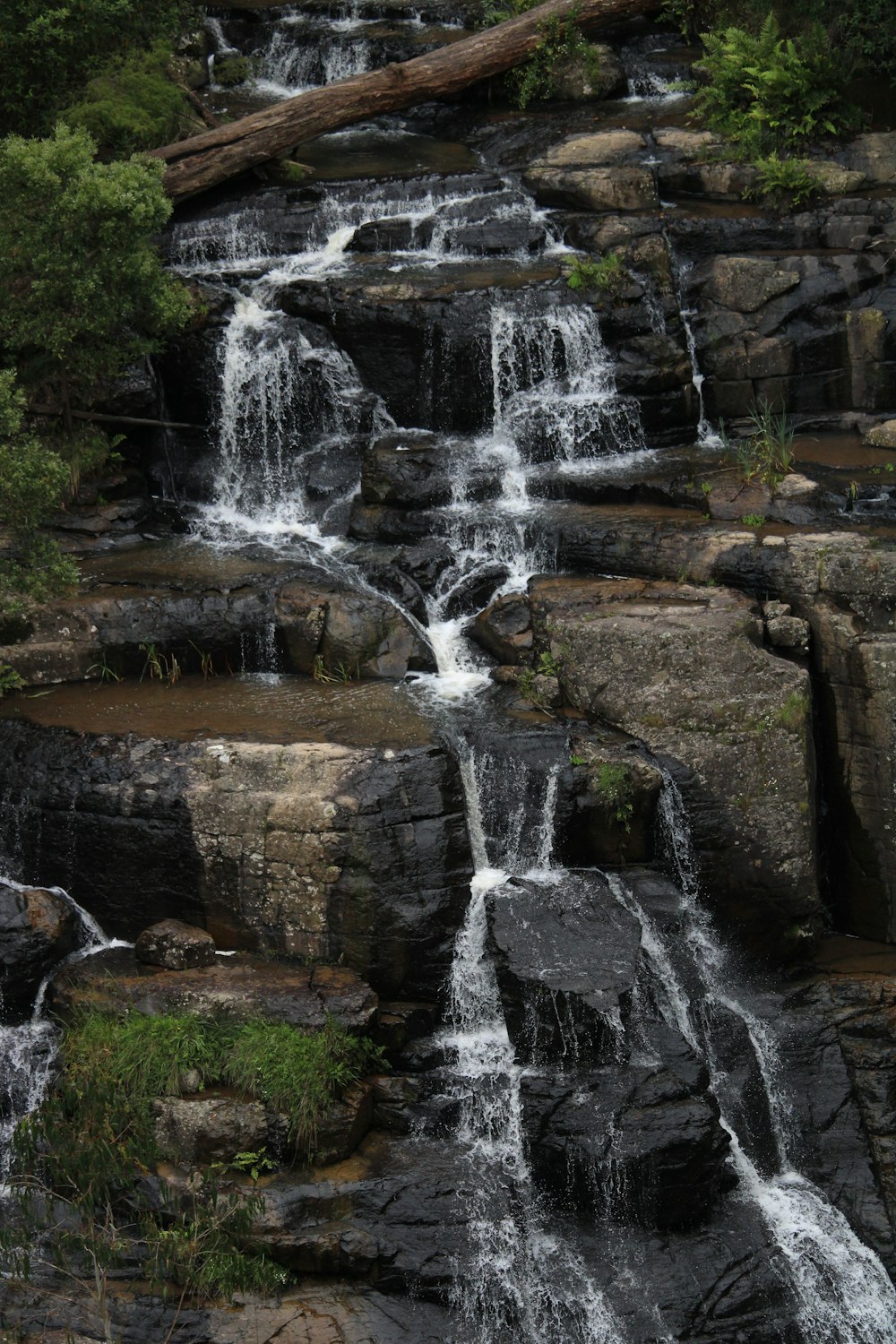 a large waterfall with lots of water coming out of it