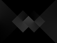 Abstract charcoal and grey geometric shapes layered over a subtle grid background.