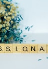 a wooden block that says,'missionary'next to a bouquet of flowers