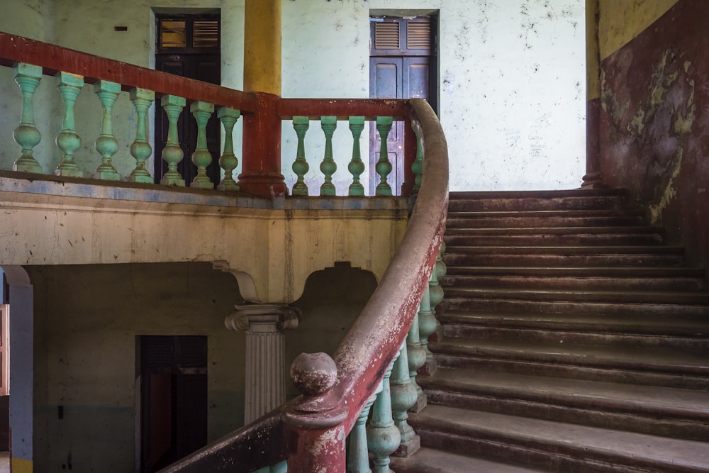 an old building with a stair case and railing