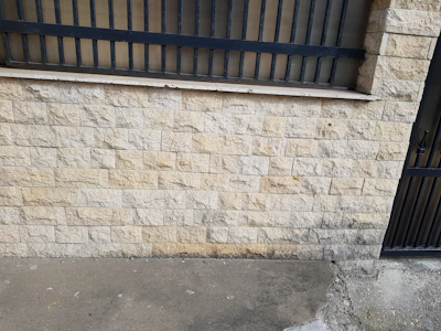 Concrete wall fencing providing a strong boundary for a large estate.