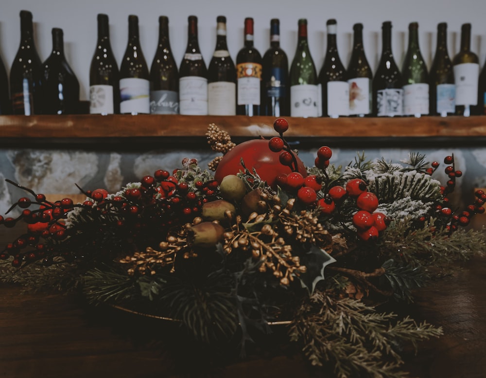 a wooden table topped with lots of bottles of wine